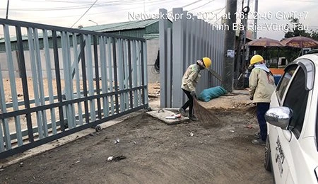 Road Cleaning Around the Project and Spraying Water